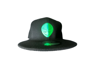 The Hat from the Hologram Moon Collection by Alien Gear Planet is a stylish and unique accessory. Made from 100% acrylic knit fabric, this black hat features a glow-in-the-dark design that's sure to captivate you with it's luminous extraterrestrial glow. Perfect for any occasion, this unique hat is designed for unisex adults and features an adjustable design for added comfort. Designed by the music artist Roksta, this beanie is a must-have for fans or anyone looking to add a touch of alien-inspired style to their wardrobe.

Glow In The Dark
65% Cotton, 35% Polyester
Snap closure
Hand Wash Only
Adjustable Snapback

One Size fits Most Head Sizes Roksta
